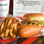 Cook Out burger, fries and drink served on a tray