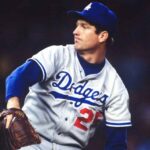 Tommy John pitching in a Los Angeles Dodgers uniform