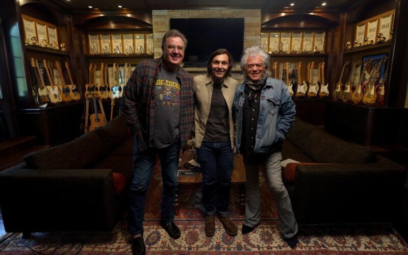 Musicians standing together in a recording studio for Vince Gill’s Marty And Me project.